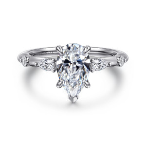 Gabriel & Co. ER16666P6PT4JJ platinum Starlight engagement ring, front view of a pear shaped center with a pointed tip prong and diamond stations either side