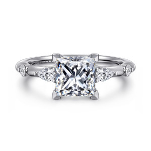 Gabriel & Co. ER16666S6W84JJ 18 karat white gold Starlight engagement ring, front view of a princess cut center flanked by an elongated and a round stone on each side
