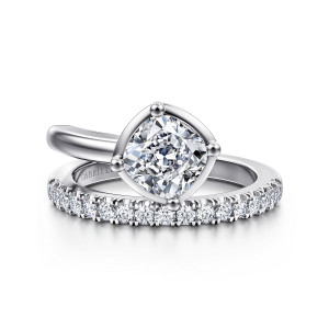 Gabriel & Co. ER16668C6W44JJ 14 karat white gold Contemporary engagement ring, front view of a cushion center turned on point in a frame above a row of round stones