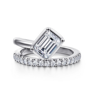 Gabriel & Co. ER16668E6W44JJ 14 karat white gold Contemporary engagement ring, front view of the emerald cut center turned on a diagonal above the diamond set arm