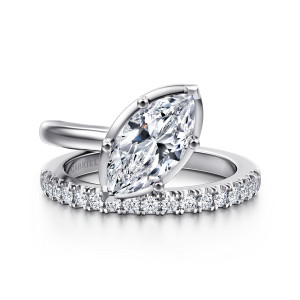 Gabriel & Co. ER16668M6W44JJ 14 karat white gold Contemporary engagement ring, front view of a slanted marquise center in a thin rim beside a diamond set arm