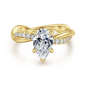 Gabriel & Co. ER16669P6Y44JJ 14 karat yellow gold Contemporary engagement ring, front view of a pear shaped center with small diamonds along a crossing strand of the band