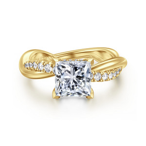 Gabriel & Co. ER16669S6Y44JJ 14 karat yellow gold Contemporary engagement ring, front view of a princess center with small round stones running along the crossing band