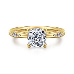 Gabriel & Co. ER16670C6Y44JJ 14 karat yellow gold Contemporary engagement ring, front view of a cushion cut center on four ball tipped prongs with diamond clusters on the shoulders