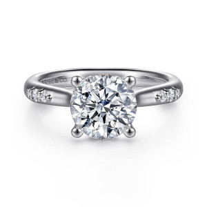 Gabriel & Co. ER16670R8W44JJ 14 karat white gold Contemporary engagement ring, front view of a round center with four ball tipped prongs and small diamond clusters on the band