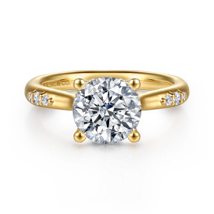 Gabriel & Co. ER16670R8Y44JJ 14 karat yellow gold Contemporary engagement ring, front view of a round center on ball tipped prongs with small diamonds on each shoulder