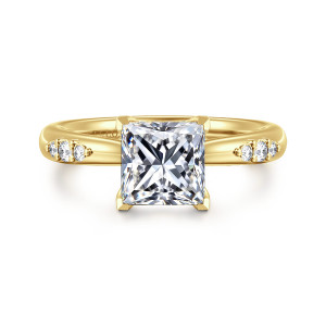 Gabriel & Co. ER16670S6Y44JJ 14 karat yellow gold Contemporary engagement ring, front view of a princess cut center in angular corner prongs with stone groups beside it