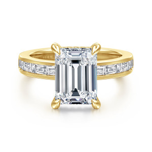 Gabriel & Co. ER16671E12Y43JJ 14 karat yellow gold Contemporary engagement ring, front view of an emerald cut center with channel set baguettes along both shoulders