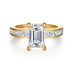 Gabriel & Co. ER16671E8Y43JJ 14 karat yellow gold Contemporary engagement ring, front view of an emerald cut center between channel set step cut diamonds on each shoulder