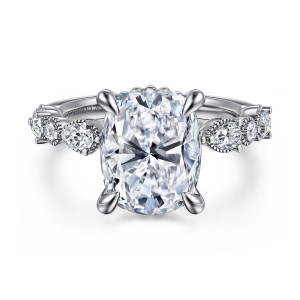 Gabriel & Co. ER16672G17W44JJ 14 karat white gold Victorian engagement ring, front view of an elongated cushion center held by rounded prongs above milgrain framed shoulders