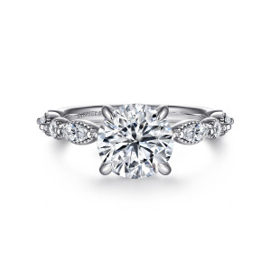 Gabriel & Co. ER16673R8W44JJ 14 karat white gold Victorian engagement ring, front view of a round center flanked by elongated diamonds in beaded edged settings