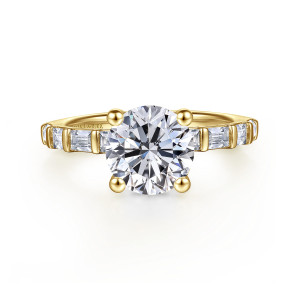 Gabriel & Co. ER16674R8Y44JJ 14 karat yellow gold Contemporary engagement ring, front view of a round center with ball tipped prongs and baguettes along the band