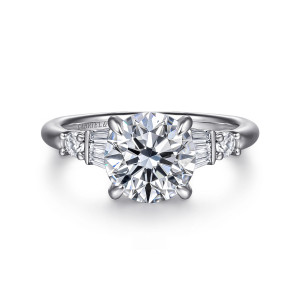 Gabriel & Co. ER16676R8W44JJ 14 karat white gold Contemporary engagement ring, front view of the round center with baguette clusters and a small round stone on each side