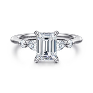 Gabriel & Co. ER16677E6T44JJ 14 karat white and rose gold Contemporary engagement ring, front view of an emerald cut center in corner prongs flanked by an elongated and a round stone