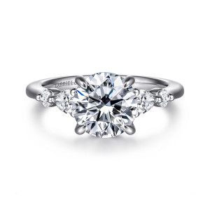 Gabriel & Co. ER16677R8T44JJ 14 karat white and rose gold Contemporary engagement ring, front view of a round center with elongated and round diamonds beaded on each shoulder