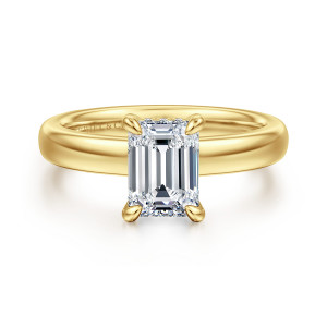 Gabriel & Co. ER16680E6Y44JJ 14 karat yellow gold Classic engagement ring, front view of an emerald cut center in rounded corner prongs over a wide smooth domed band
