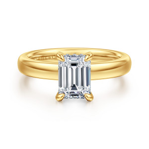 Gabriel & Co. ER16680E6Y84JJ 18 karat yellow gold Classic engagement ring, front view of an emerald cut center in corner prongs on a wide smooth band