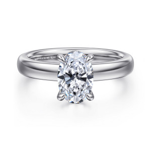 Gabriel & Co. ER16680O6PT4JJ platinum Classic engagement ring, front view of an oval center between clawed prongs on a wide domed band