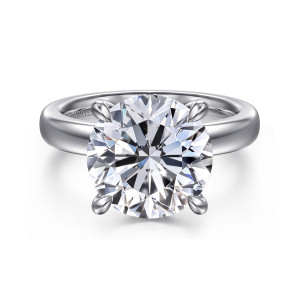 Gabriel & Co. ER16680R20W44JJ 14 karat white gold Classic engagement ring, front view of a large round center in four flared prongs on a wide polished band