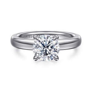 Gabriel & Co. ER16680R6W84JJ 18 karat white gold Classic engagement ring, front view of a round center in four prongs on a thick polished band with a maker's mark