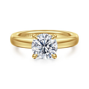 Gabriel & Co. ER16680R6Y44JJ 14 karat yellow gold Classic engagement ring, front view of a round center in four claw prongs on a broad, softly rounded band