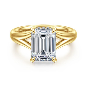 Gabriel & Co. ER16683E12Y44JJ 14 karat yellow gold Contemporary engagement ring, front view of an emerald cut center with the band splitting into open arms on both sides