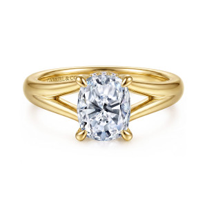 Gabriel & Co. ER16683G8Y44JJ 14 karat yellow gold Contemporary engagement ring, front view of an elongated cushion center in four claws, with the split shank open on both sides