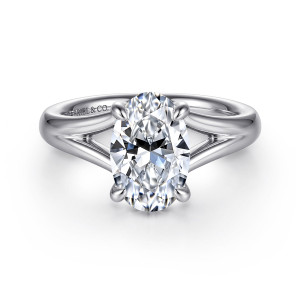 Gabriel & Co. ER16683O8W44JJ 14 karat white gold Contemporary engagement ring, front view of an oval center on four claws with the shank splitting open beneath it
