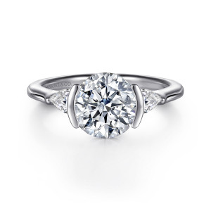 Gabriel & Co. ER16685R8W44JJ 14 karat white gold Bujukan engagement ring, front view of a round center gripped by two upright bars with an elongated stone on each side