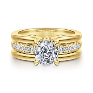 Gabriel & Co. ER16686C6Y44JJ 14 karat yellow gold Contemporary engagement ring, front view of a cushion cut center with rounded prong tips and diamonds along the middle rail
