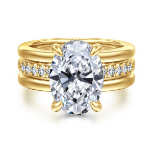 Gabriel & Co. ER16686O17Y44JJ 14 karat yellow gold Contemporary engagement ring, front view of an oval center in four claw prongs over rails framing a diamond strip