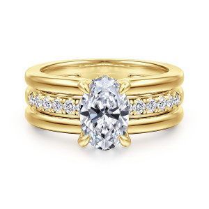 Gabriel & Co. ER16686O6Y44JJ 14 karat yellow gold Contemporary engagement ring, front view of an oval center with teardrop prongs above a middle rail of small diamonds