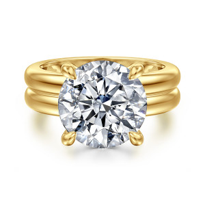 Gabriel & Co. ER16687R20Y44JJ 14 karat yellow gold Bujukan engagement ring, front view of a large round center in four claw prongs above a broad band with a groove