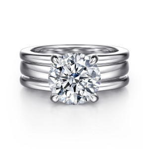 Gabriel & Co. ER16688R12W44JJ 14 karat white gold Bujukan engagement ring, front view of a round center held by four prongs above a wide band with two grooves