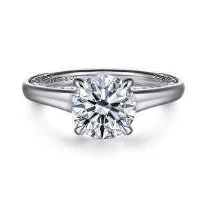 Gabriel & Co. ER16691R8W44JJ 14 karat white gold Classic engagement ring, front view of the round center in four claw prongs above a smooth band with beading glimpsed inside