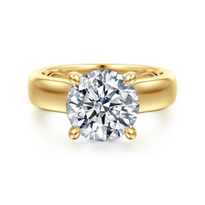 Gabriel & Co. ER16692R12Y44JJ 14 karat yellow gold Bujukan engagement ring, front view of a round center held by slim tapered prongs on a wide polished band