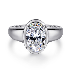 Gabriel & Co. ER16697O8W44JJ 14 karat white gold Contemporary engagement ring, front view of an oval center inside a smooth collar on a wide band