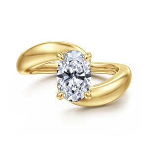 Gabriel & Co. ER16698O6Y4JJJ 14 karat yellow gold Contemporary engagement ring, front view of a bypass band with rounded ends passing beside an oval center