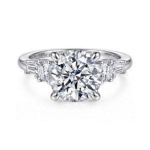 Gabriel & Co. ER16700R12W44JJ 14 karat white gold Contemporary engagement ring, front view of a round center with a round stone and a baguette on each shoulder