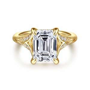 Gabriel & Co. ER16704E12Y44JJ 14 karat yellow gold Contemporary engagement ring, front view of an emerald cut center in four corner claws with leaf shaped branches at each shoulder