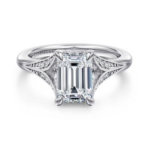 Gabriel & Co. ER16704E8W44JJ 14 karat white gold Contemporary engagement ring, front view of an emerald cut center with rounded prongs and split arms holding small diamonds