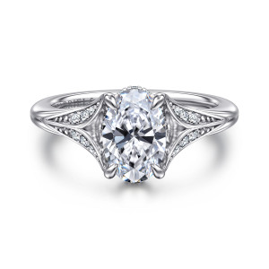 Gabriel & Co. ER16704O6W44JJ 14 karat white gold Contemporary engagement ring, front view of an oval center on four claw prongs between split shoulders set with diamonds