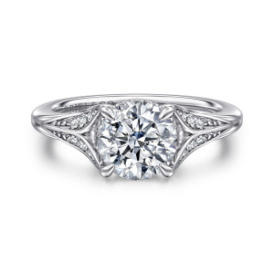 Gabriel & Co. ER16704R6W44JJ 14 karat white gold Contemporary engagement ring, front view of a round center with four pointed prongs above leaf shaped diamond shoulders