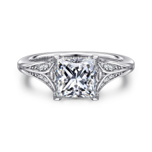 Gabriel & Co. ER16704S6W44JJ 14 karat white gold Contemporary engagement ring, front view of a princess cut center between leaf shaped shoulders set with small diamonds