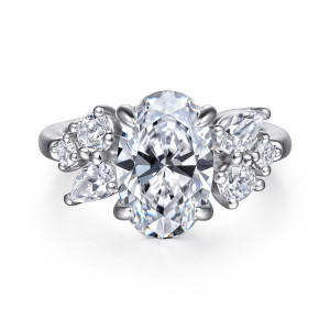 Gabriel & Co. ER16705O12W44JJ 14 karat white gold Starlight engagement ring, front view of two clusters of round and elongated diamonds flanking the oval center