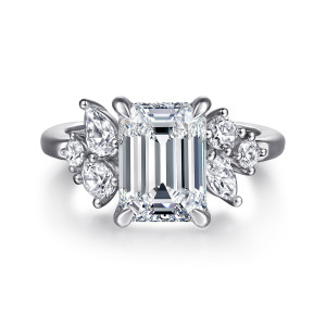 Gabriel & Co. ER16706E12W44JJ 14 karat white gold Starlight engagement ring, front view of an emerald cut center with clusters of round and elongated stones on both shoulders
