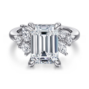 Gabriel & Co. ER16706E18W44JJ 14 karat white gold Starlight engagement ring, front view of an emerald cut center in corner prongs with a cluster of stones on each shoulder