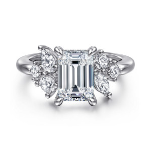 Gabriel & Co. ER16706E8W44JJ 14 karat white gold Starlight engagement ring, front view of an emerald cut center with mixed round and elongated stones gathered at each side
