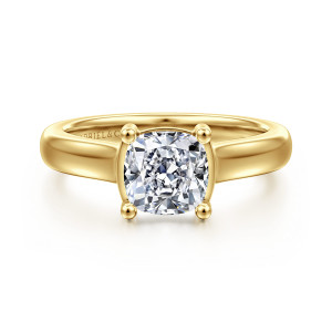 Gabriel & Co. ER16707C6Y44JJ 14 karat yellow gold Contemporary engagement ring, front view of a cushion cut center held by ball tipped prongs at a smooth broad band