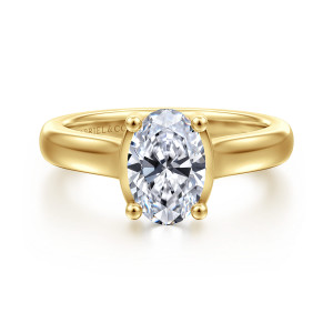 Gabriel & Co. ER16707O6Y44JJ 14 karat yellow gold Contemporary engagement ring, front view of an oval center held by four round tipped prongs on a smooth broad band